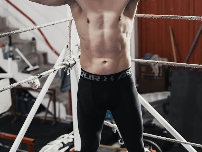 Man in a powerful stance during a workout.